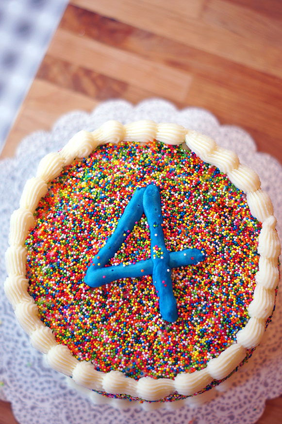 Sprinkle Covered Birthday Cake with homemade Funfetti cake inside! (Plus the secret to covering a cake in sprinkles without rolling the whole cake around!)