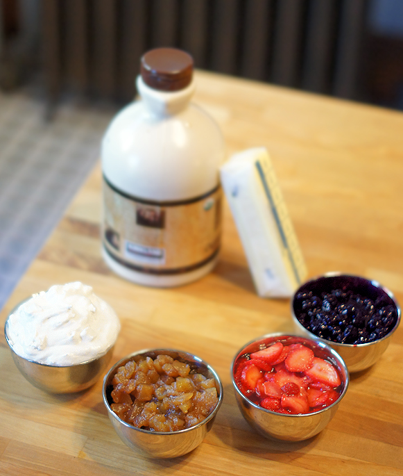 Homemade (vegan and gluten free) Waffle Toppings from four simple techniques -- coconut whipped cream, sugared strawberries, apple compote, blueberry compote