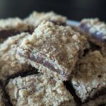 Bar cookie with a layers of oatmeal crumble, fudge, and oatmeal crust.